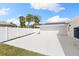 Spacious backyard featuring a white fence and ample space for outdoor activities and entertainment at 4646 Gleason Ave, Sarasota, FL 34242