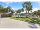 Scenic backyard view showcasing palm trees and a tranquil body of water, creating a serene outdoor setting at 4646 Gleason Ave, Sarasota, FL 34242
