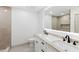 Bright bathroom with a double sink vanity, a large mirror, and a walk-in shower at 4646 Gleason Ave, Sarasota, FL 34242