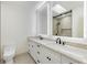 Modern bathroom with double sinks, a walk-in shower, and contemporary fixtures at 4646 Gleason Ave, Sarasota, FL 34242