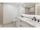Modern bathroom featuring a double sink vanity, sleek black fixtures, and an LED-lit mirror at 4646 Gleason Ave, Sarasota, FL 34242