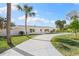 Charming single-story home featuring a freshly painted exterior, well-manicured lawn, and inviting curb appeal at 4646 Gleason Ave, Sarasota, FL 34242