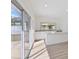 Living room with bright natural light and sliding glass doors to the backyard at 4646 Gleason Ave, Sarasota, FL 34242