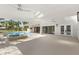 Relaxing pool and spa area with covered patio, ceiling fans and tropical landscaping, perfect for outdoor living at 4646 Gleason Ave, Sarasota, FL 34242
