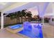 Backyard oasis featuring a pool, a spa, a built-in water feature, and privacy fencing with mature trees at 4646 Gleason Ave, Sarasota, FL 34242