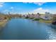 Scenic water view showcasing waterfront homes, lush greenery, and serene water, highlighting community tranquility at 4646 Gleason Ave, Sarasota, FL 34242
