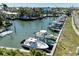 Aerial view of canal with boats docked at private boat slips along the waterfront at 502 69Th St, Holmes Beach, FL 34217