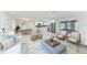 Bright, open living space featuring modern furnishings and a seamless flow into the kitchen and dining areas at 502 69Th St, Holmes Beach, FL 34217