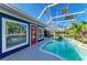 Outdoor pool area featuring tropical landscaping, screened enclosure and paver decking at 502 69Th St, Holmes Beach, FL 34217