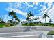Gated community entrance showcases lush landscaping and an elegant gatehouse for a secure and welcoming arrival at 5562 Rain Lily Ct, Sarasota, FL 34238