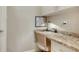 Desk area with granite countertop and storage at 5562 Rain Lily Ct, Sarasota, FL 34238