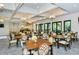 Elegant clubhouse dining area with stylish chandeliers and tables ready for social gatherings at 5562 Rain Lily Ct, Sarasota, FL 34238