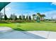 Well-maintained dog park featuring play structures and grassy areas for pets to enjoy, under a sunny blue sky at 5562 Rain Lily Ct, Sarasota, FL 34238