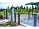 Fenced dog park offers separate areas for large and small dogs, with grassy areas and play equipment at 5562 Rain Lily Ct, Sarasota, FL 34238