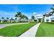 Picturesque community entrance featuring a fountain and lush green landscaping at 5562 Rain Lily Ct, Sarasota, FL 34238