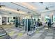 A well-equipped fitness center with treadmills, weight machines, and a mirror wall for workout convenience at 5562 Rain Lily Ct, Sarasota, FL 34238