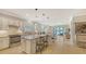 Open-concept kitchen featuring granite countertops, stainless steel appliances, and a large center island at 5562 Rain Lily Ct, Sarasota, FL 34238