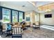 Relaxing clubhouse lounge features comfortable seating, stylish decor, and a view of lush landscaping at 5562 Rain Lily Ct, Sarasota, FL 34238