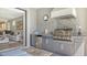 This home has a full outdoor kitchen with stainless steel grill and granite countertops, perfect for entertaining guests at 5562 Rain Lily Ct, Sarasota, FL 34238