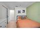 Comfortable bedroom with an accent wall, light floors, and ample space at 5611 22Nd E St, Bradenton, FL 34203