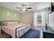 Serene bedroom with natural light, a plush rug, and cozy decor at 5611 22Nd E St, Bradenton, FL 34203