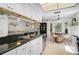 Bright updated kitchen featuring stainless appliances, granite counters, and an eat-in dining area with a barrel table at 5611 22Nd E St, Bradenton, FL 34203