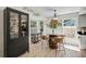Bright kitchen featuring an eat-in table with barrel style stand, hardwood floors, and modern decor at 5611 22Nd E St, Bradenton, FL 34203