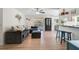 Bright living room boasts an open floorplan, light wood floors, and a view of the screened patio at 5611 22Nd E St, Bradenton, FL 34203