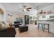 Bright living room with an open floorplan, light wood floors, and modern decor at 5611 22Nd E St, Bradenton, FL 34203