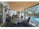 Covered patio area featuring comfortable seating and a view of the sparkling pool, perfect for relaxing outdoors at 5611 22Nd E St, Bradenton, FL 34203