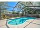 Inviting backyard with a sparkling screened-in pool, perfect for enjoying outdoor living and recreation at 5611 22Nd E St, Bradenton, FL 34203