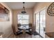 Cozy breakfast nook area featuring a glass table and a view of the lanai at 5633 Sheffield Greene Cir # 40, Sarasota, FL 34235