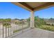 Balcony view of a residential street and neighboring homes, providing a serene outdoor space to relax at 5954 Anise Dr, Sarasota, FL 34238