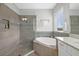 Luxurious bathroom featuring a glass-enclosed shower, a soaking tub, and a single vanity with ample counter space at 5954 Anise Dr, Sarasota, FL 34238