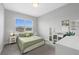 Bright bedroom with a large window and a comfortable bed, complemented by a clean desk and ample workspace at 5954 Anise Dr, Sarasota, FL 34238