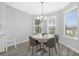 Bright breakfast nook with tile flooring and large windows with neighborhood views at 5954 Anise Dr, Sarasota, FL 34238