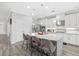 Gourmet kitchen with stainless steel appliances and a large island with barstool seating at 5954 Anise Dr, Sarasota, FL 34238