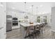 Kitchen with granite countertops, stainless steel appliances, and an island with barstool seating at 5954 Anise Dr, Sarasota, FL 34238
