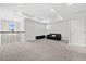 Expansive loft area with a black leather sofa and a decorative railing, creating a versatile living space at 5954 Anise Dr, Sarasota, FL 34238