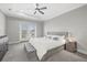 Inviting main bedroom with french doors, a tufted ottoman, and stylish bedside table, creating a relaxing retreat at 5954 Anise Dr, Sarasota, FL 34238