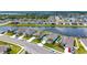 Aerial view of community featuring lush landscaping, solar panels, and a serene water view at 6105 114Th E Dr, Parrish, FL 34219