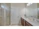 Elegant bathroom featuring double sinks, quartz countertop, and a glass shower at 6105 114Th E Dr, Parrish, FL 34219