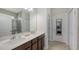 Bathroom with double sinks, modern cabinets, and a walk-in shower at 6105 114Th E Dr, Parrish, FL 34219