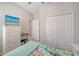 Bright bedroom featuring white furniture and a window with mermaid-themed bedding at 6105 114Th E Dr, Parrish, FL 34219