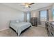 Calm bedroom with a large window, neutral walls, and carpeted floors at 6105 114Th E Dr, Parrish, FL 34219