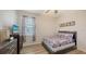 Comfortable bedroom features TV, hardwood floors and a comfortable looking bed at 6105 114Th E Dr, Parrish, FL 34219