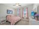 Inviting bedroom with carpet, TV, and a serene atmosphere at 6105 114Th E Dr, Parrish, FL 34219