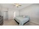 Bright bedroom featuring carpeted floors, a ceiling fan, and a window at 6105 114Th E Dr, Parrish, FL 34219