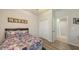 Comfortable bedroom features hardwood floors, closet space, and a bed at 6105 114Th E Dr, Parrish, FL 34219