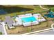 Aerial view of the community pool, playground, and pond in The Retreat at Willow Bend at 6105 114Th E Dr, Parrish, FL 34219